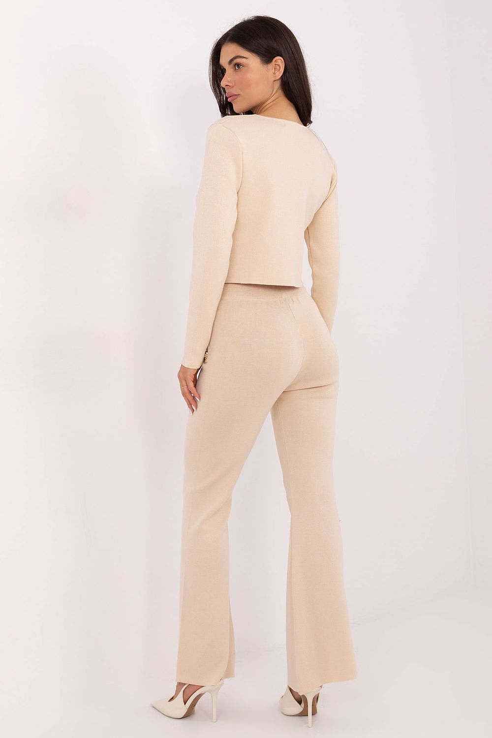 Stylish women's cardigan with snap closure, highlighting elegance in everyday fashion, crafted from viscose-polyester blend by Factory Price.