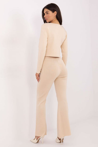 Stylish women's cardigan with snap closure, highlighting elegance in everyday fashion, crafted from viscose-polyester blend by Factory Price.