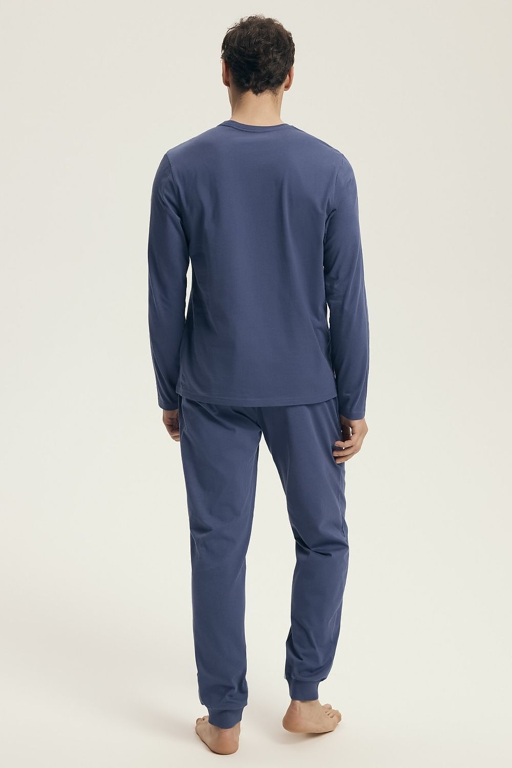 Luxury Henderson Men's Cotton Pyjama Set featuring an adjustable waist, elegantly packed for a perfect gift. Includes a long-sleeved shirt with a subtle print and comfortable pants with pockets.