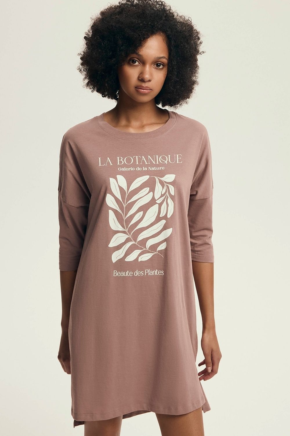 Luxurious Henderson Women's Cotton Nightshirt featuring 3/4 sleeves, delicate print, and a flattering loose fit, ideal for comfort during sleep, available in sizes S to XL.