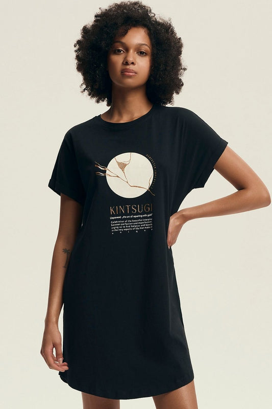 Elegant Henderson women's knee-length nightshirt crafted from soft cotton with a U-neckline and short sleeves, showcasing a delicate printed design.