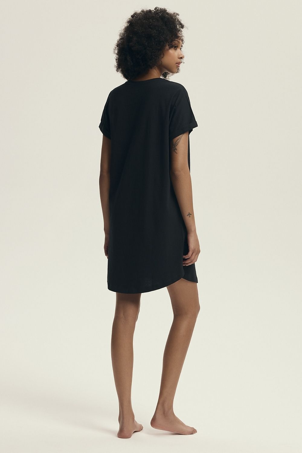 Chic Henderson knee-length nightshirt designed for the modern woman, offering both comfort and a feminine touch in a breathable cotton fabric.