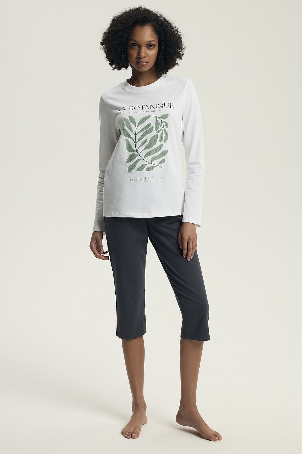 Henderson Women's Cotton Pyjama Set featuring a stylish long-sleeved blouse with delicate print and 3/4 slim-fit pants, designed for luxurious comfort in sleep and relaxation.