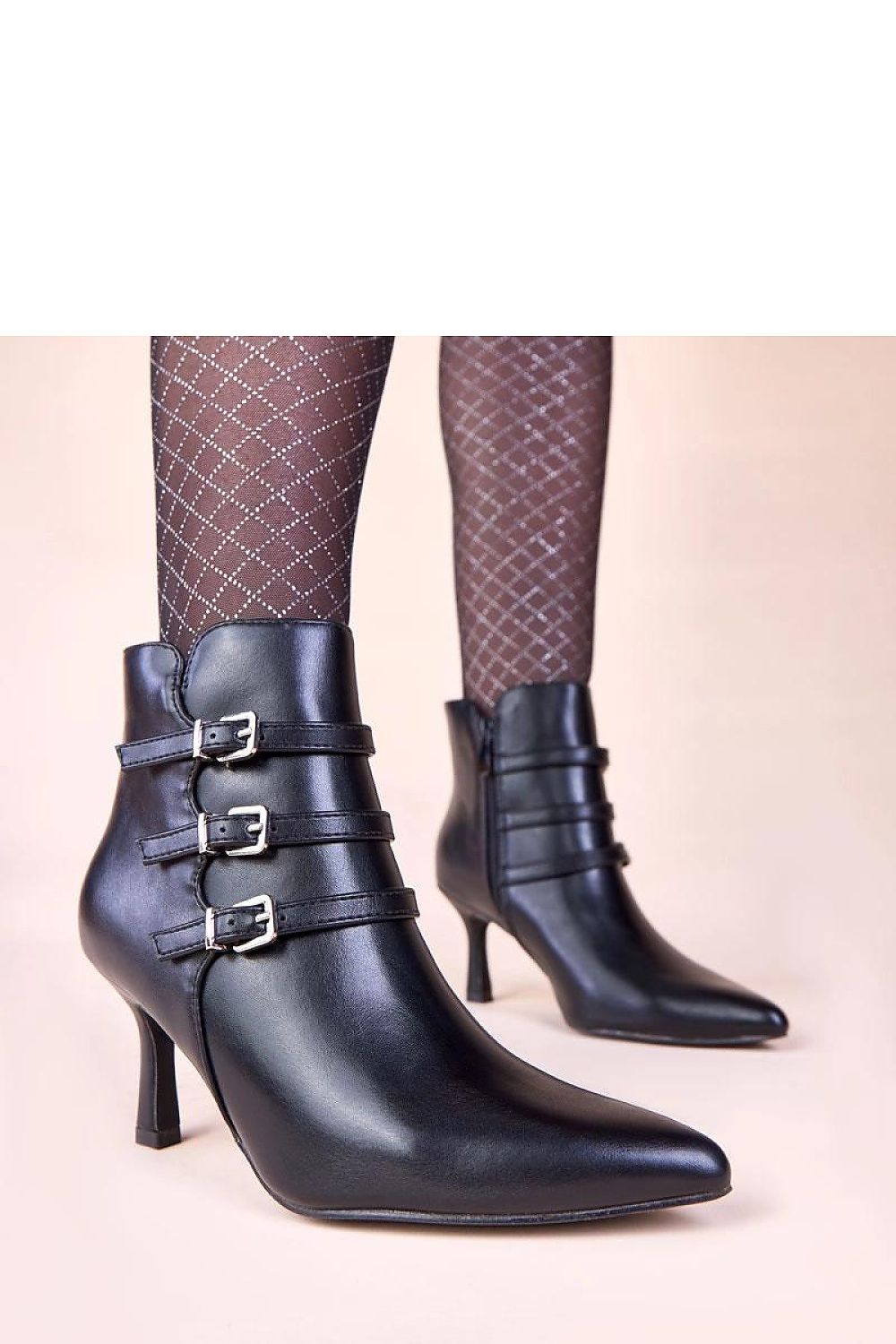 Elegant Solea black heeled ankle boots featuring decorative buckles, crafted for comfort and style, suitable for various occasions.