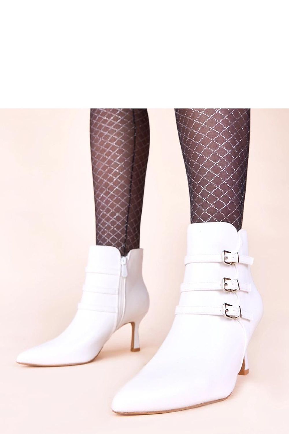 Elegant display of Solea Black Heeled Ankle Boots alongside fashionable accessories, inspiring luxurious outfit combinations for day-to-night wear.