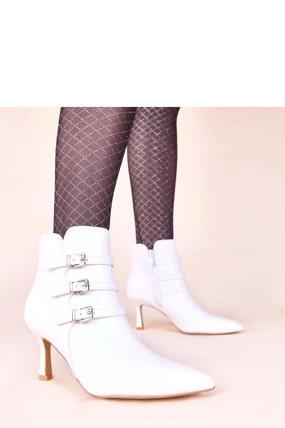 Solea Black Heeled Ankle Boots styled with trendy apparel, presenting a sophisticated look for any occasion, blending comfort and fashion flawlessly.