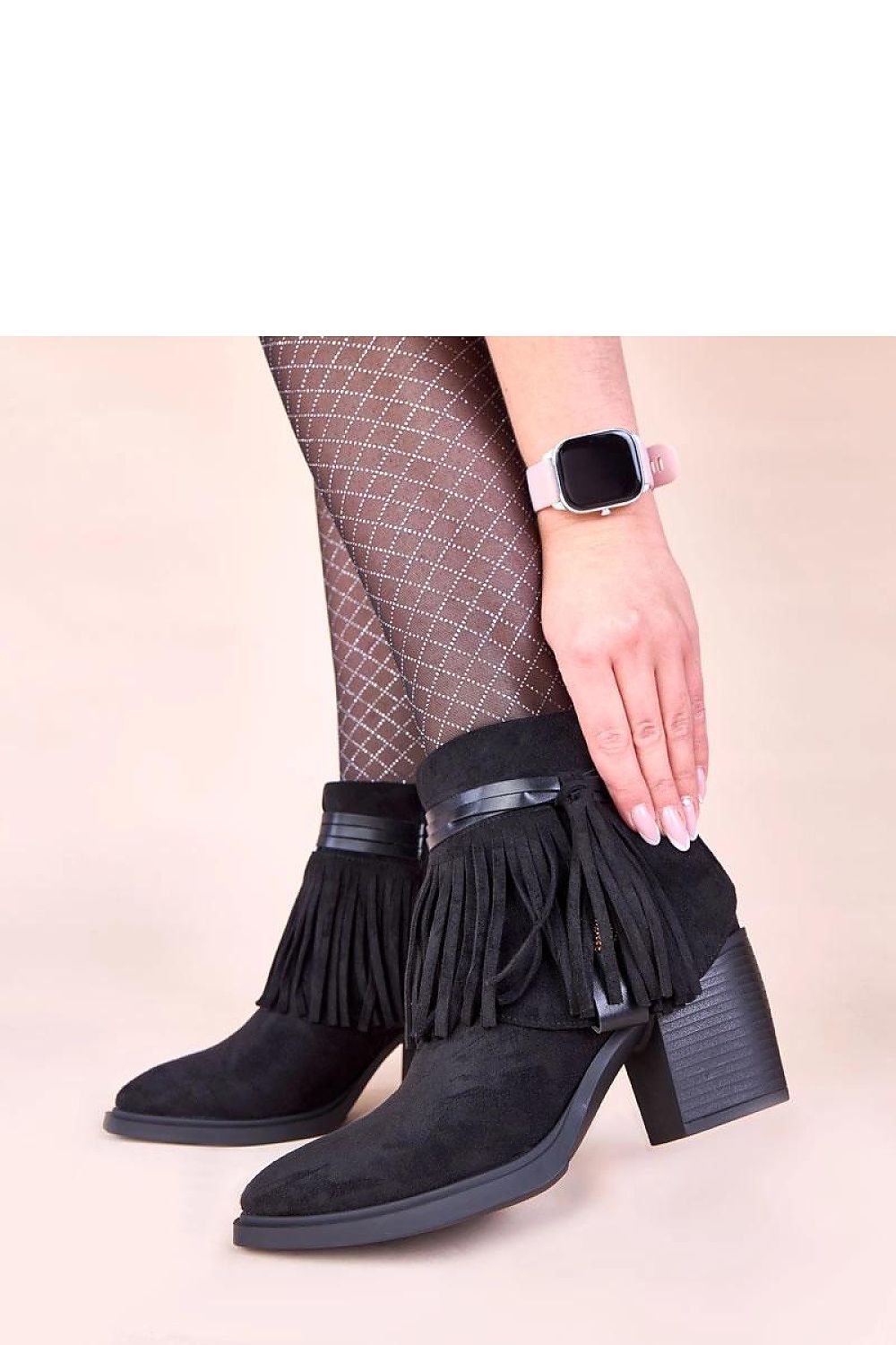 Solea's luxurious black fringed ankle boots showcasing high-quality imitation leather suede, designed for comfort and elegant style.