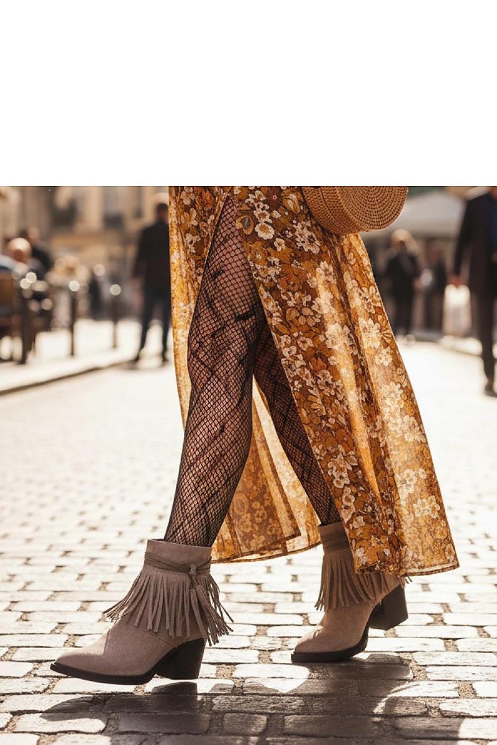 Close-up view of Solea's black fringed ankle boots showcasing premium imitation leather suede and intricate fringe detailing, ideal for modern fashion enthusiasts.