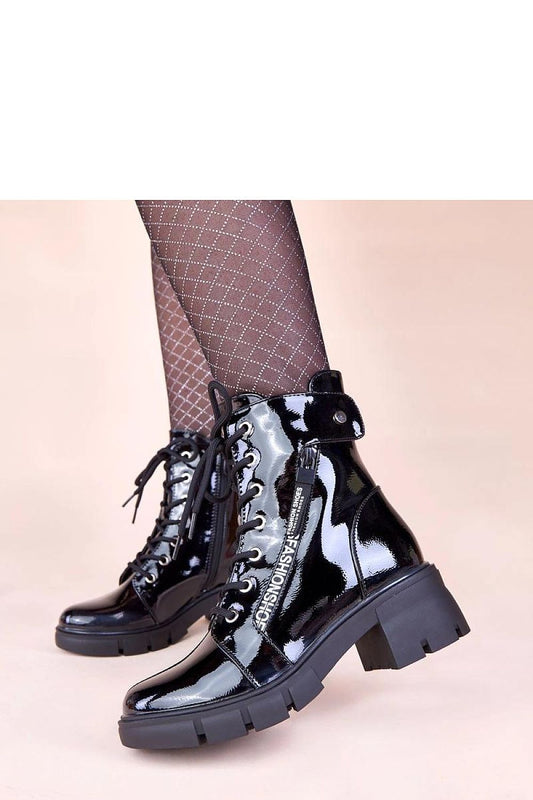 Close-up of the Solea Ailis Black Patent Ankle Boots, highlighting the high-quality artificial leather and contemporary design ideal for chic outfits.