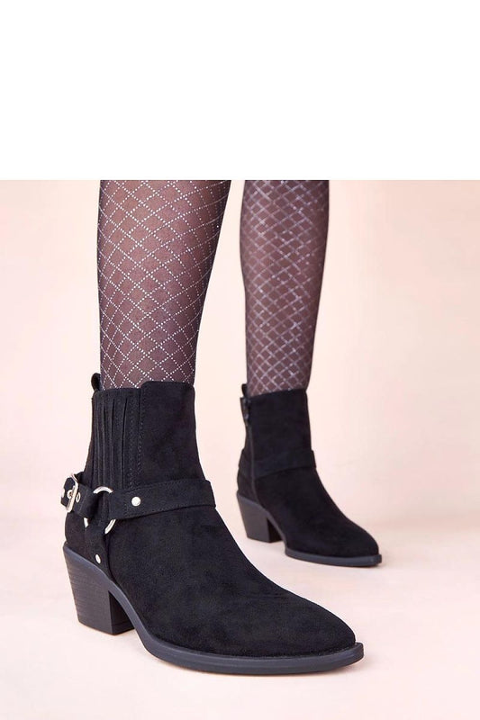 Elegant Solea Ritama black heeled ankle boots featuring decorative buckles, crafted for luxury and comfort.