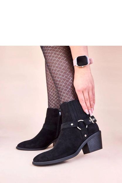 Stylish Solea Ritama ankle boots in black suede, showcasing sophisticated decorative buckles for an upscale look.