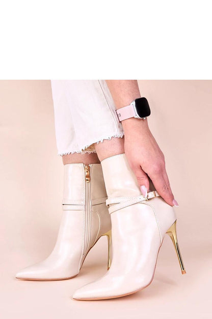 Elegant beige ankle boots with shiny gold stiletto heel from Solea, perfect for any occasion.