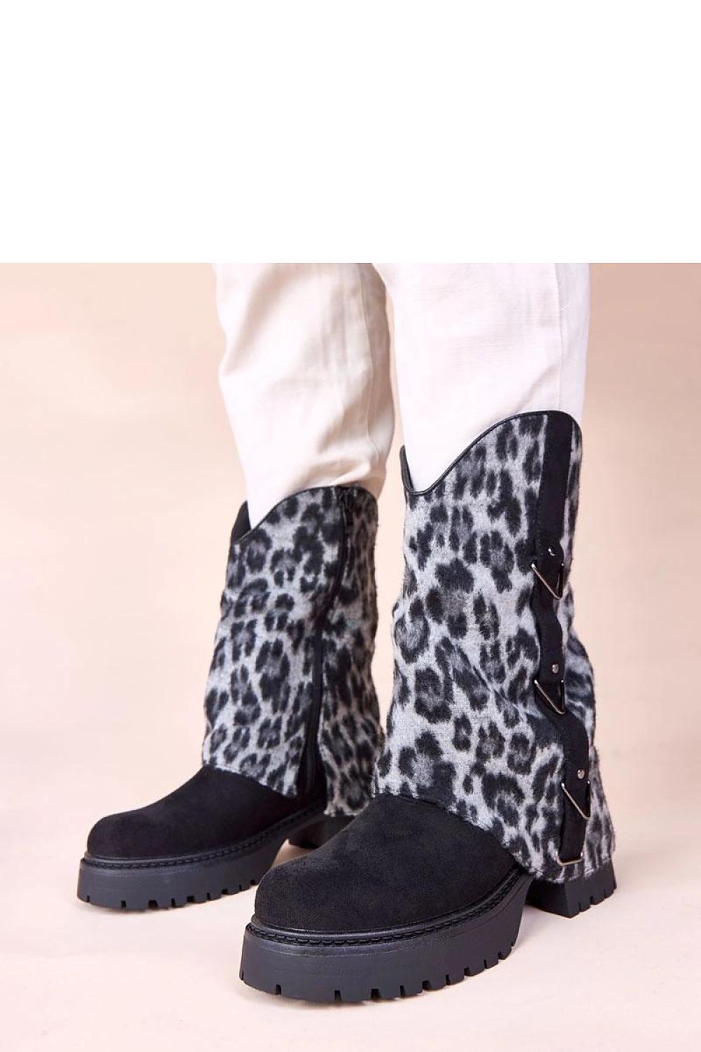 Solea Kaylia black ankle boots with stylish leopard print rolled shaft, showcasing modern elegance and comfort, perfect for colder days and versatile outfit pairings.