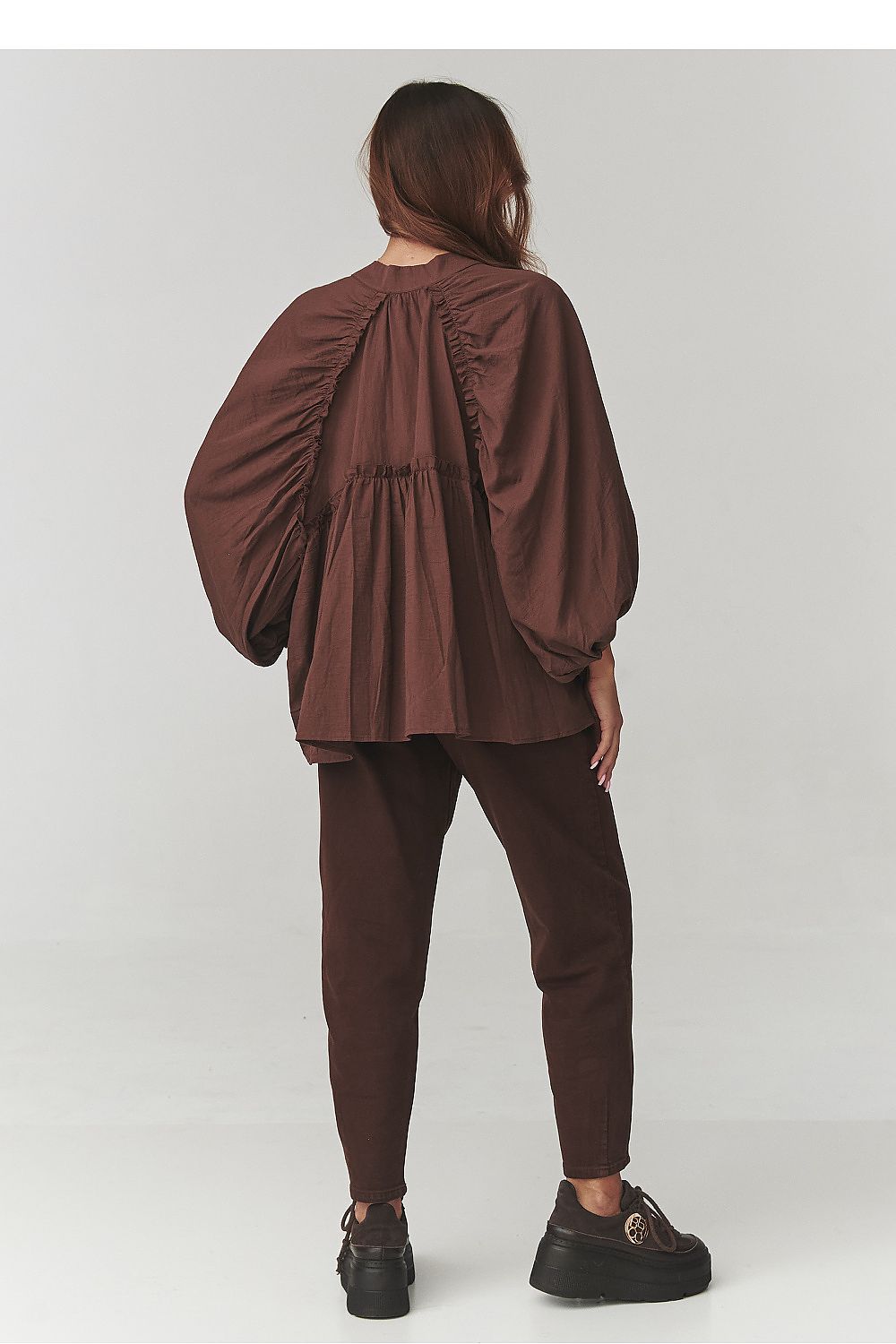 Stylish outfit with Makadamia Women's Oversize Cotton Shirt paired with elegant trousers, demonstrating versatility for any occasion.