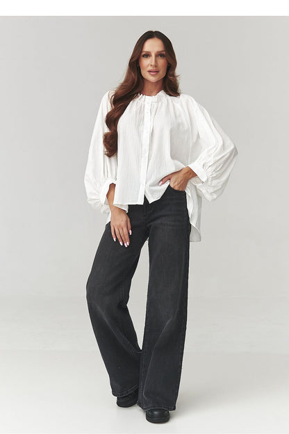 Makadamia elegant women's oversize cotton shirt in classic white, showcasing its lightweight and breathable fabric with a sophisticated drape.
