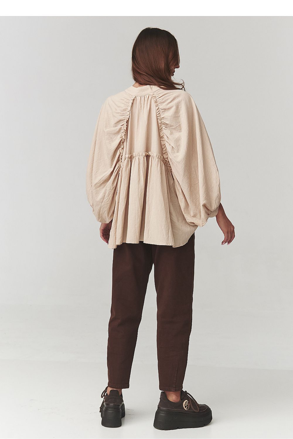 Makadamia Women's Oversize Cotton Shirt styled with elegant trousers, illustrating its versatile fashion statement for both casual and formal occasions.