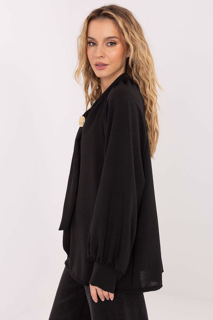 Model wearing Italy Moda's elegant blouse with tie neckline, showcasing a chic and sophisticated style suitable for work or formal occasions.