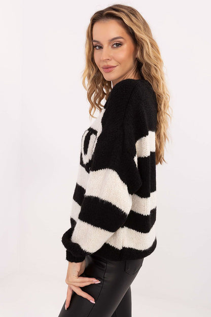 Detail view of Italy Moda's upscale oversized women's sweater, showcasing a chic striped design and soft fabric blend, ideal for a modern, sophisticated wardrobe.