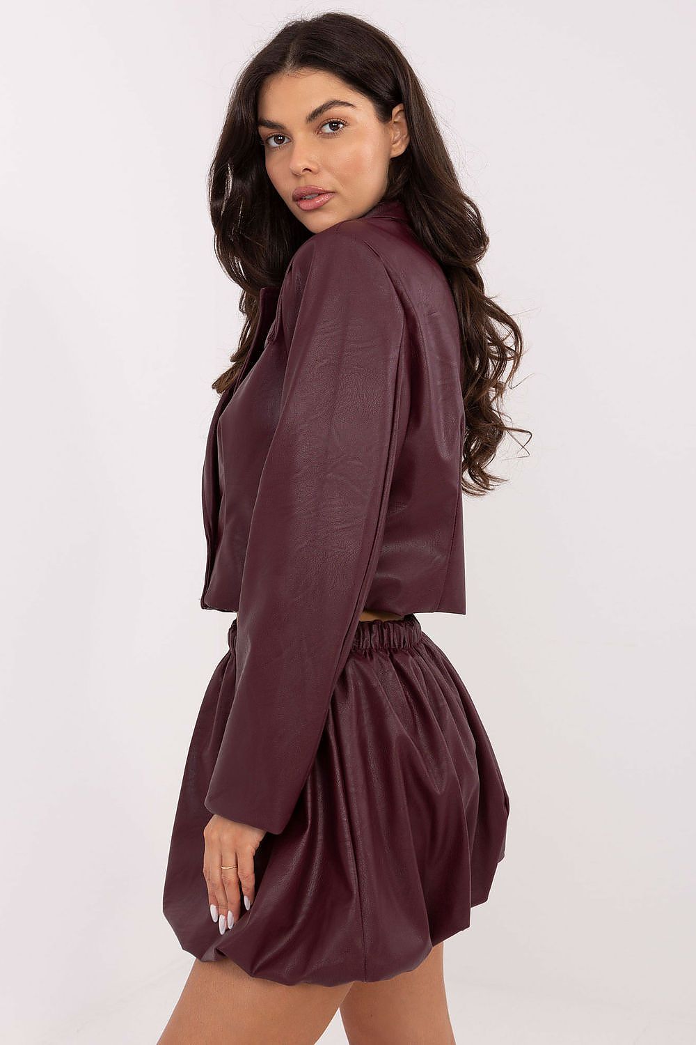 Luxurious Italy Moda casual mini skirt in imitation leather with comfortable elastic waistband, perfect for chic urban styling.