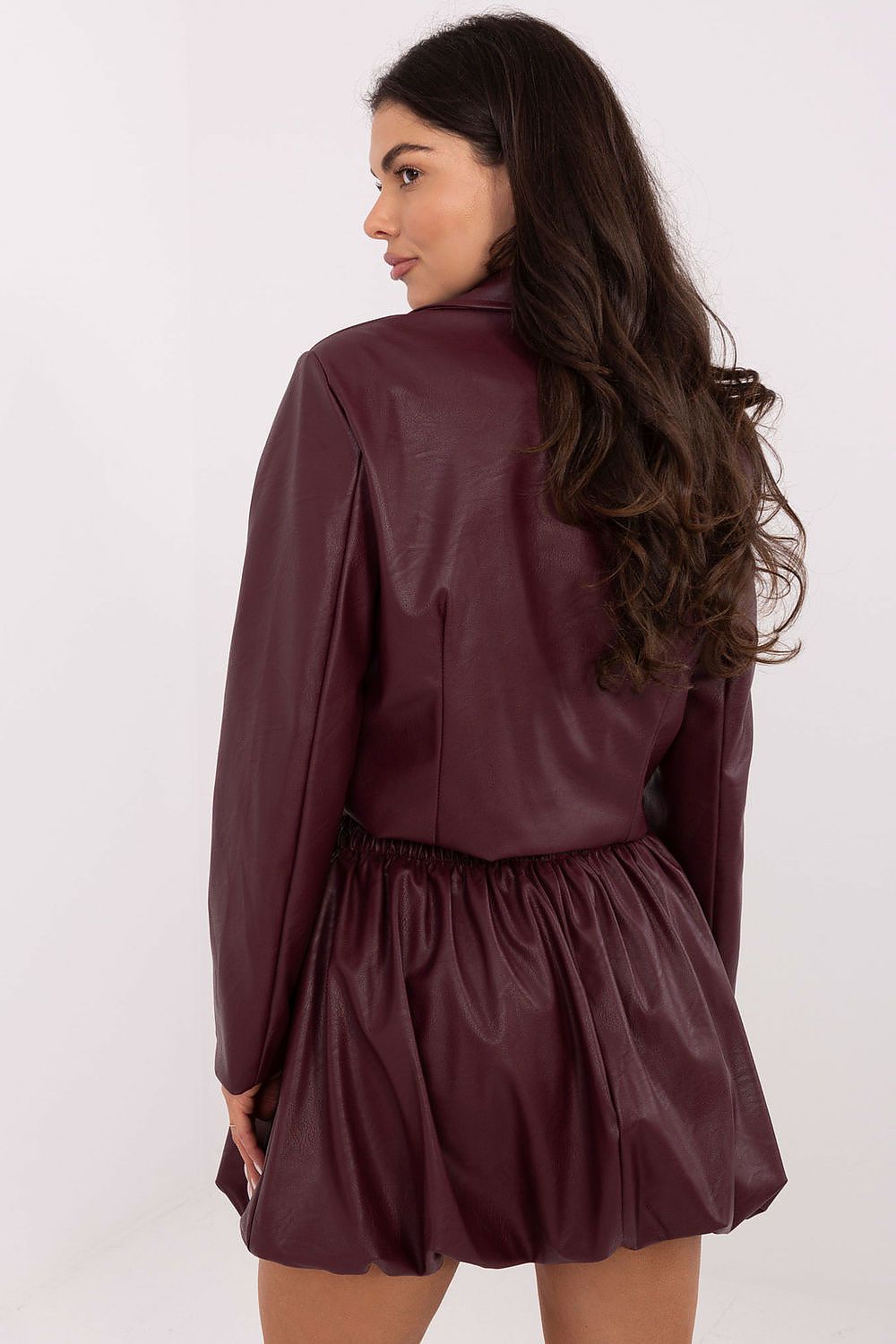 Elegant model wearing the Luxury Casual Mini Skirt in Imitation Leather by Italy Moda, highlighting the comfortable waistband and sophisticated mini length for a chic look.