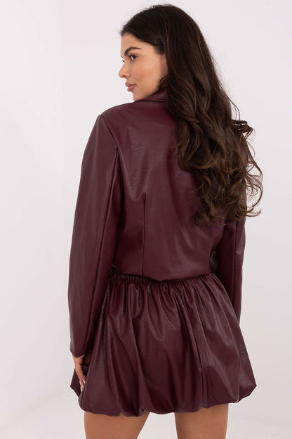 Elegant model wearing the Luxury Casual Mini Skirt in Imitation Leather by Italy Moda, highlighting the comfortable waistband and sophisticated mini length for a chic look.