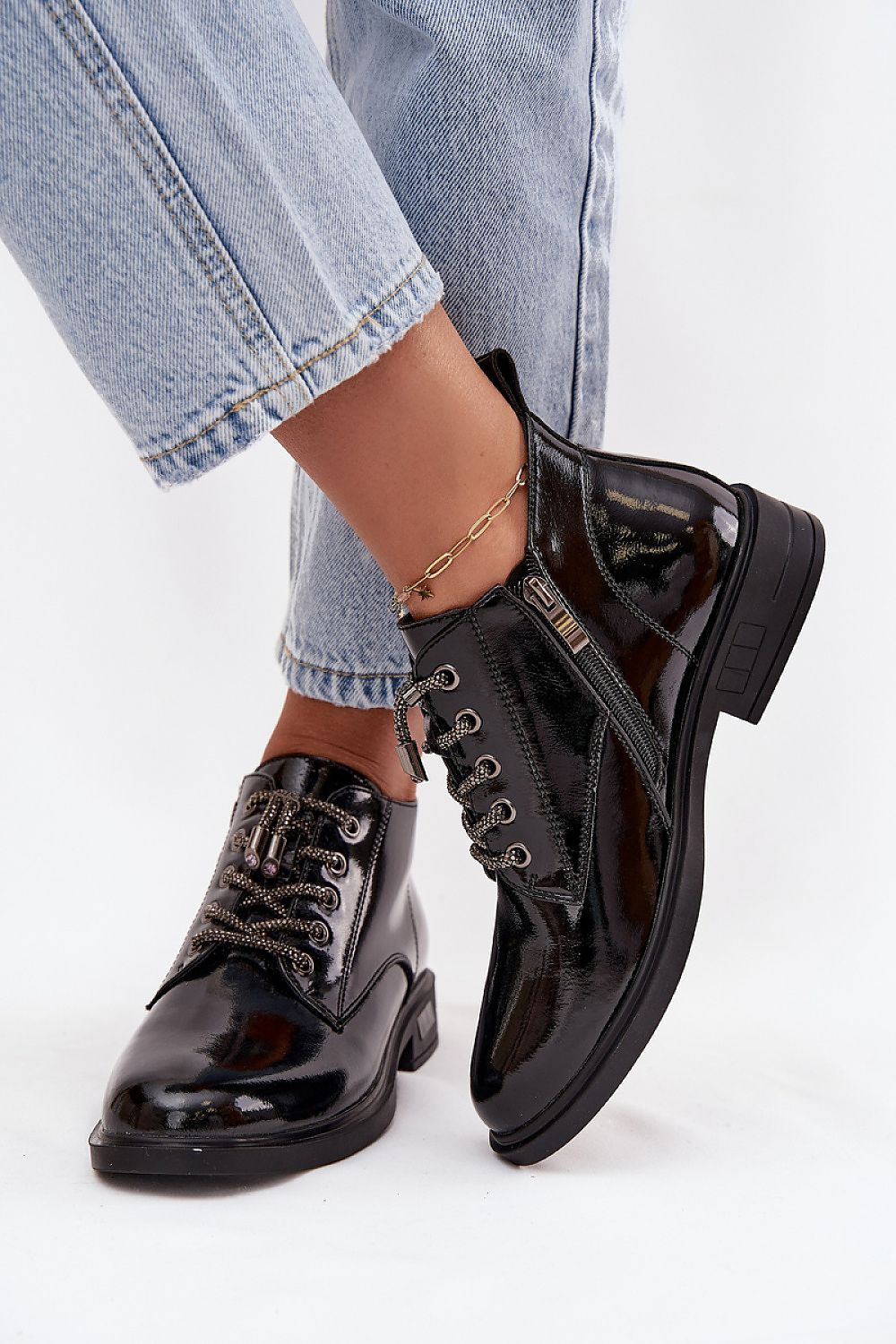 Lifestyle image of Step in Style women's ankle boots in natural patent leather, perfect for autumn-winter fashion with versatile outfit pairing options.