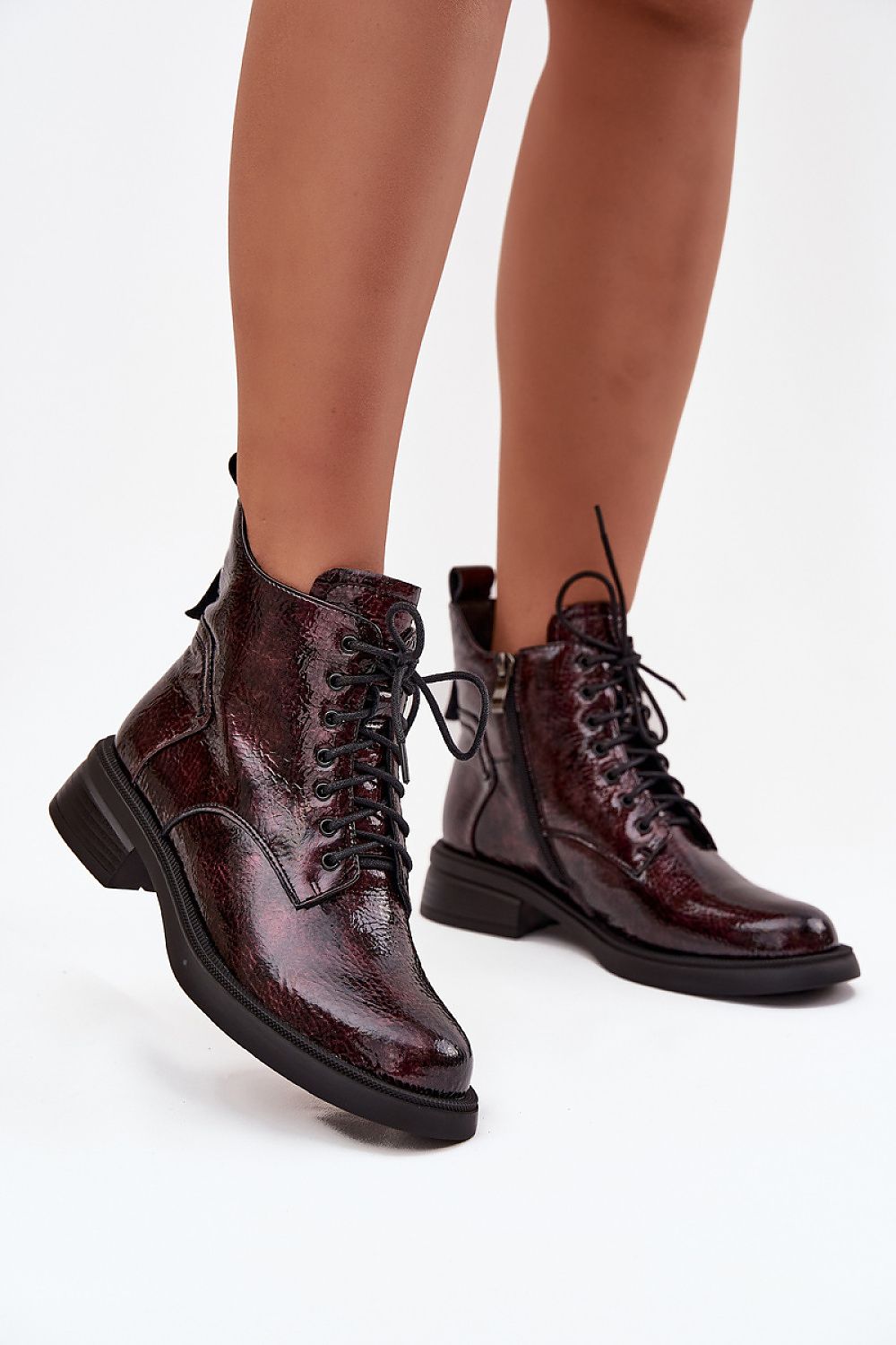 Elegant Women's Ankle Boots by Step in Style, crafted from luxurious natural patent leather, featuring a chic design with lacing and zipper for easy wear.