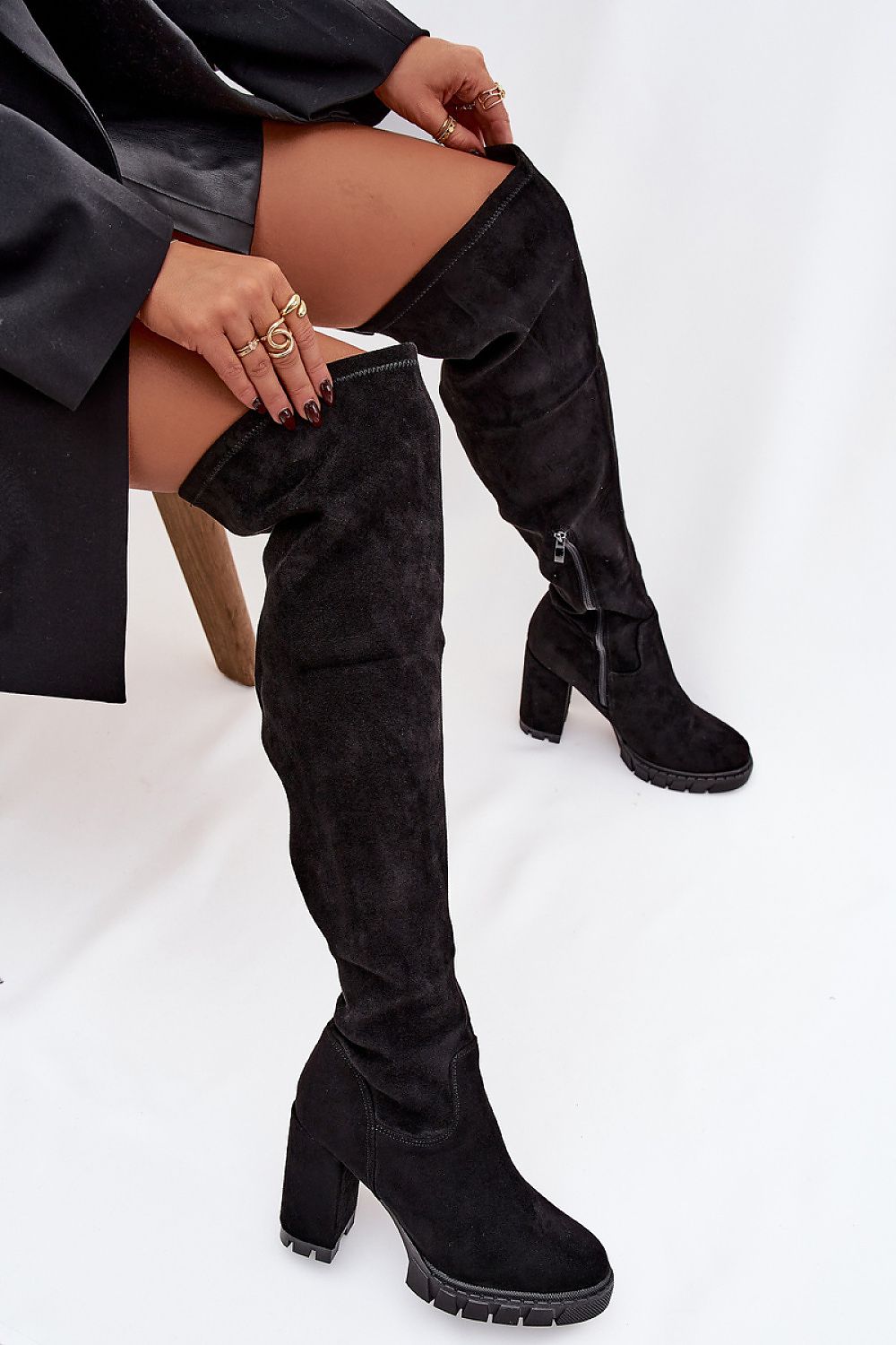 Stylish knee-high women's heel boots in various outfits by Step in Style, designed for versatile elegance and comfort.