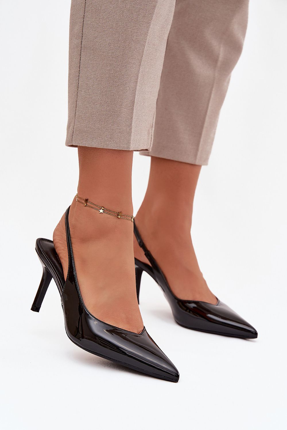 Step in style Women's High Heels Pumps in classic black, highlighting a timeless design suitable for formal and evening occasions.