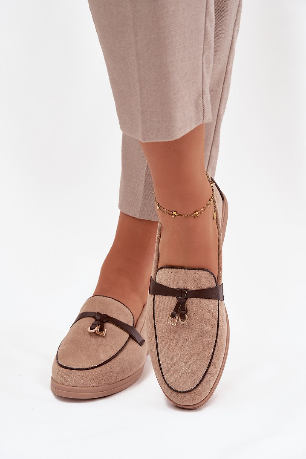 A stylish ensemble featuring Step in Style Eco Suede Loafers, emphasising comfort and elegance, available in EU sizes 36 to 41.