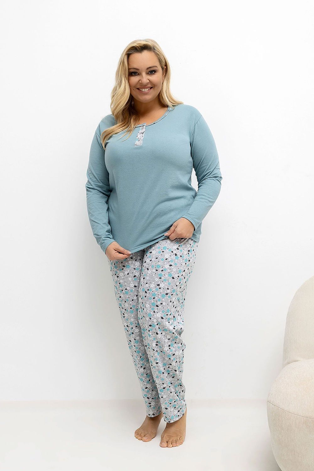 Cozy long pants and chic blouse from Forever Pink's Luxurious Plus Size Pajamas Set, perfect for a restful night in or a luxurious gift.