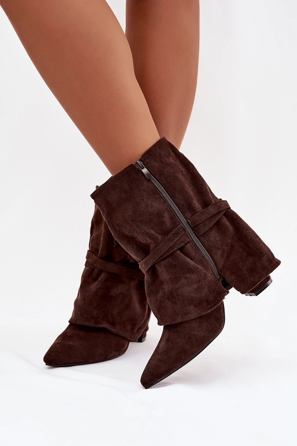Close-up of Step in Style Women's Eco Suede Ankle Boots with luxurious gold buckles and chic fringe detailing, showcasing a sustainable fashion choice.