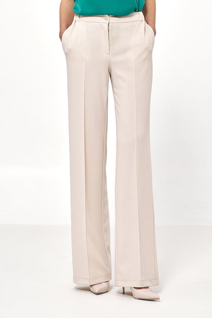 Luxury caramel loose cut trousers for women by Nife, high waist design enhancing silhouette.