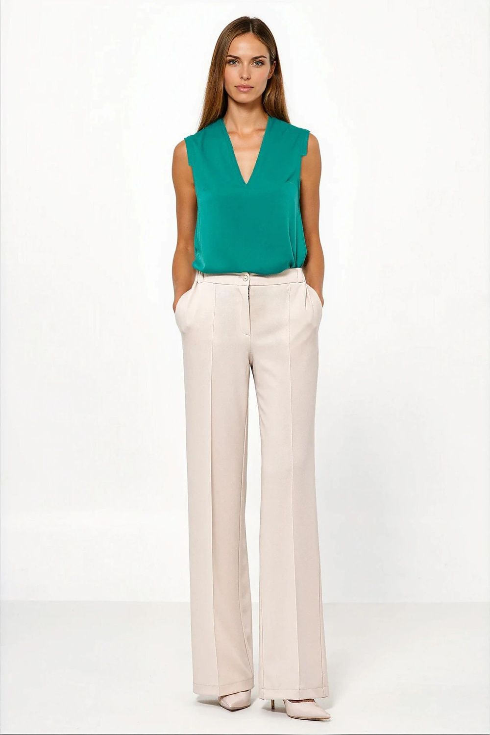 Close-up of luxurious fabric of caramel trousers for women by Nife, showcasing quality and softness.