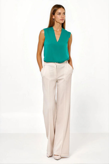 Elegant Nife luxury trousers for women in caramel colour, perfect for casual and formal occasions.