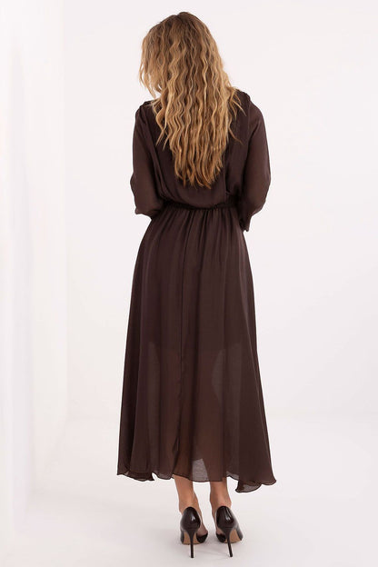 Model wearing the Elegant Rue Paris Maxi Daydress, highlighting the graceful silhouette and stylish long sleeves, perfect for various occasions.