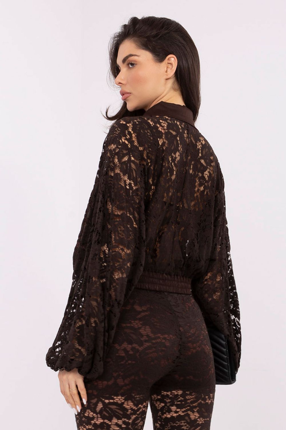 Detailed view of the button-up front and elasticated bottom of the Elegant Women's Long Sleeve Lace Shirt by Italy Moda, emphasising comfort and elegance.