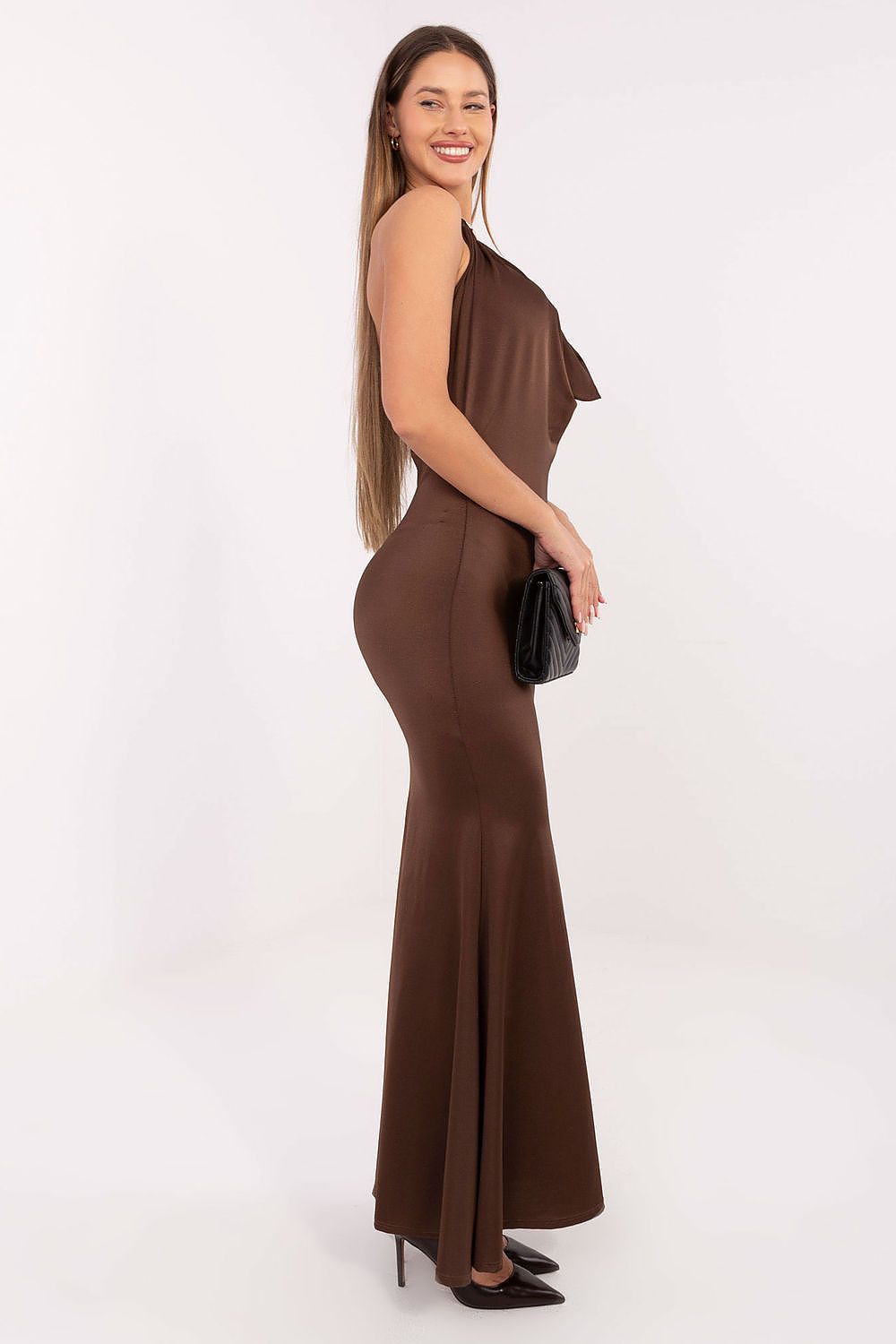 Model wearing the Elegant Sleeveless Maxi Dress by Italy Moda at a formal event, radiating luxury and sophistication.