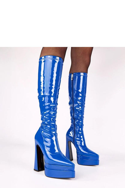 Solea Stylish Eco-Leather Heel Boots in a fashionable setting, designed for height and comfort with a chic 15cm heel and platform.