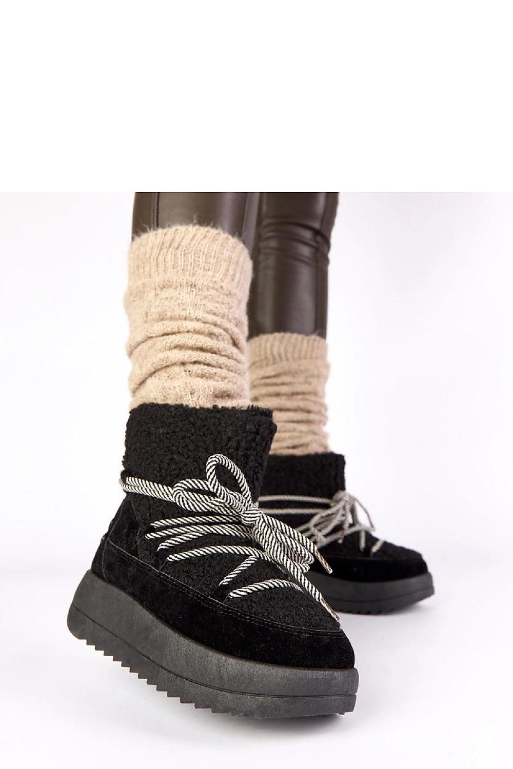 Solea Women's Black Lace-Up Snow Boots with non-slip sole, ideal for navigating icy surfaces in style and warmth.