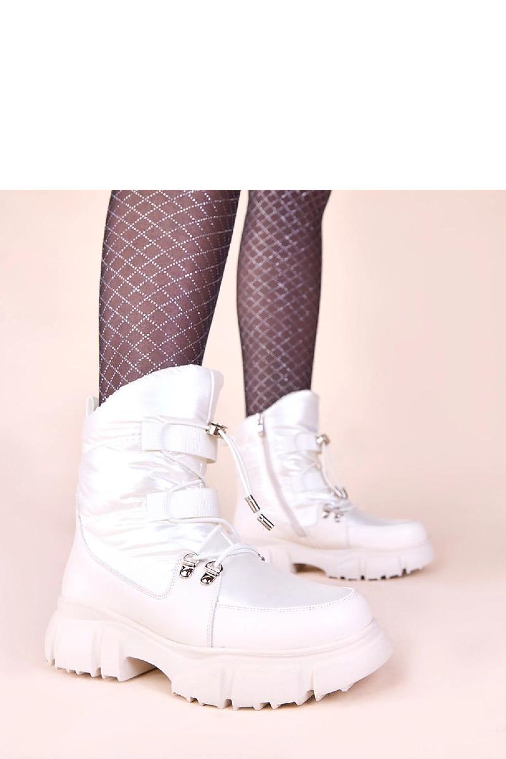 Close-up of the sturdy sole of Jassi Women's Pearl Glow Snow Boots, designed for excellent traction in winter conditions, crafted by Solea.