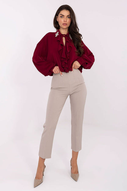 Elegant long-line polyester blouse with puff sleeves and decorative collar by Factory Price, showcasing a luxurious and modern design.