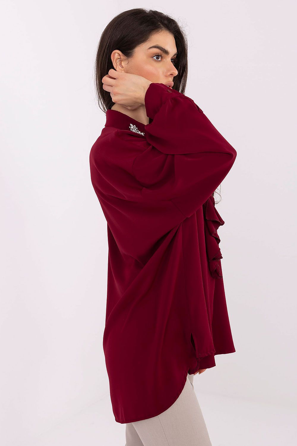 Close-up of decorative collar and puff sleeves on an elegant long-line polyester blouse by Factory Price, highlighting exquisite details and sophisticated style.