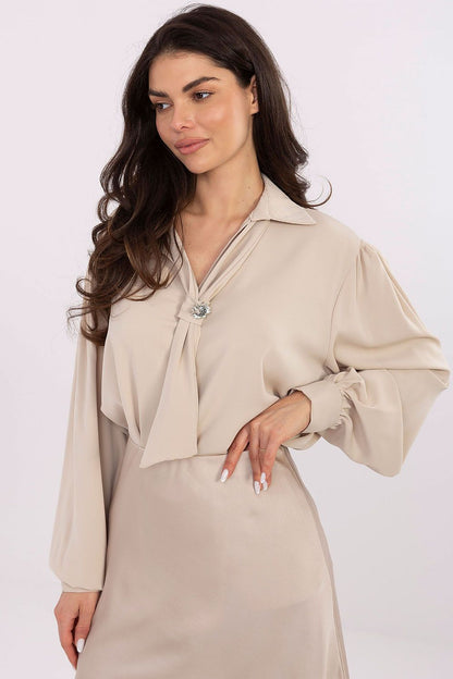 Stylish outfit transformation featuring the Elegant V-Neck Blouse with detachable brooch by Factory Price, paired with fashionable bottoms in an outdoor setting.
