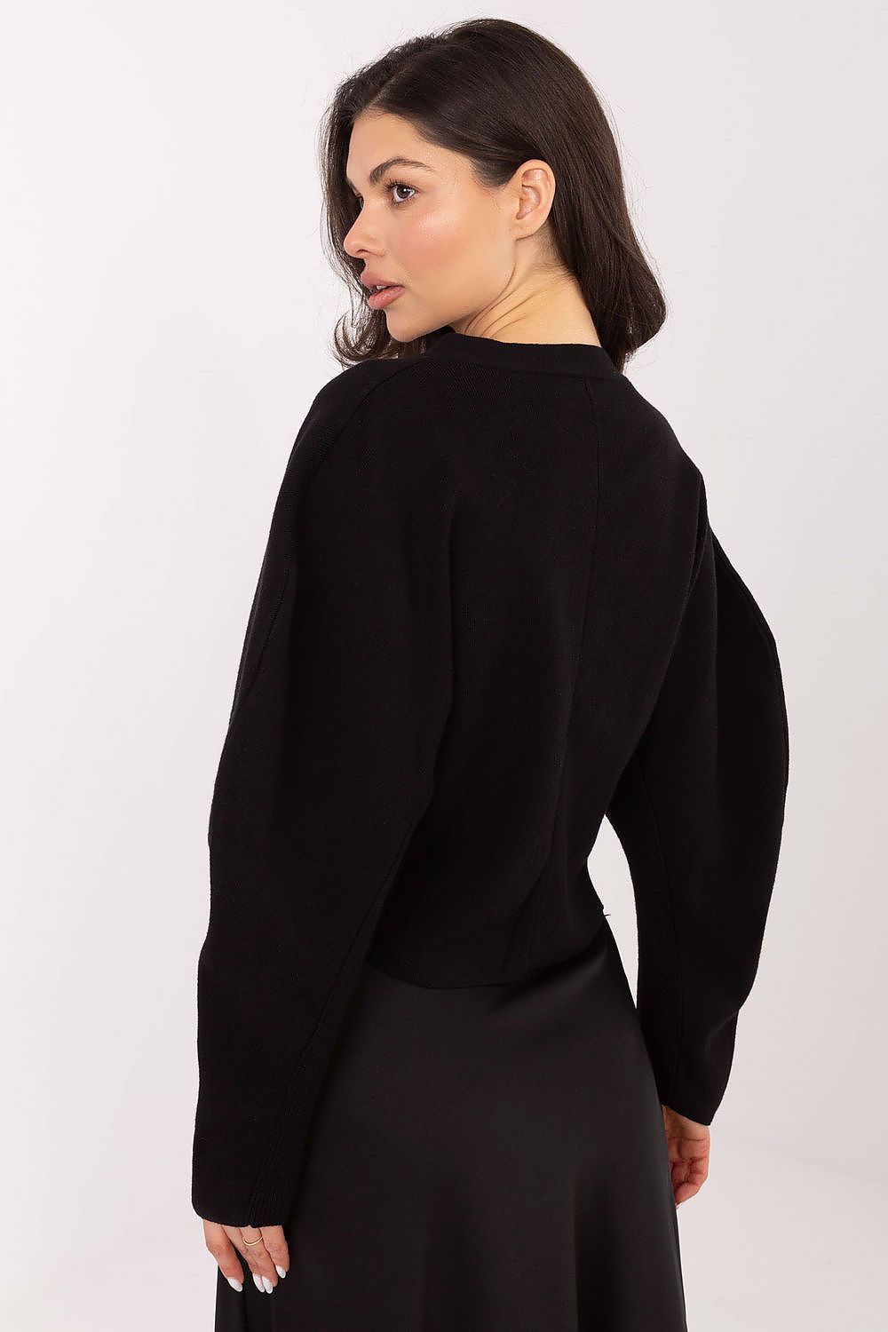 Model wearing Elegant Women's Cardigan Sweater with trendy snap closure by Factory Price, exemplifying modern elegance and chic fashion.