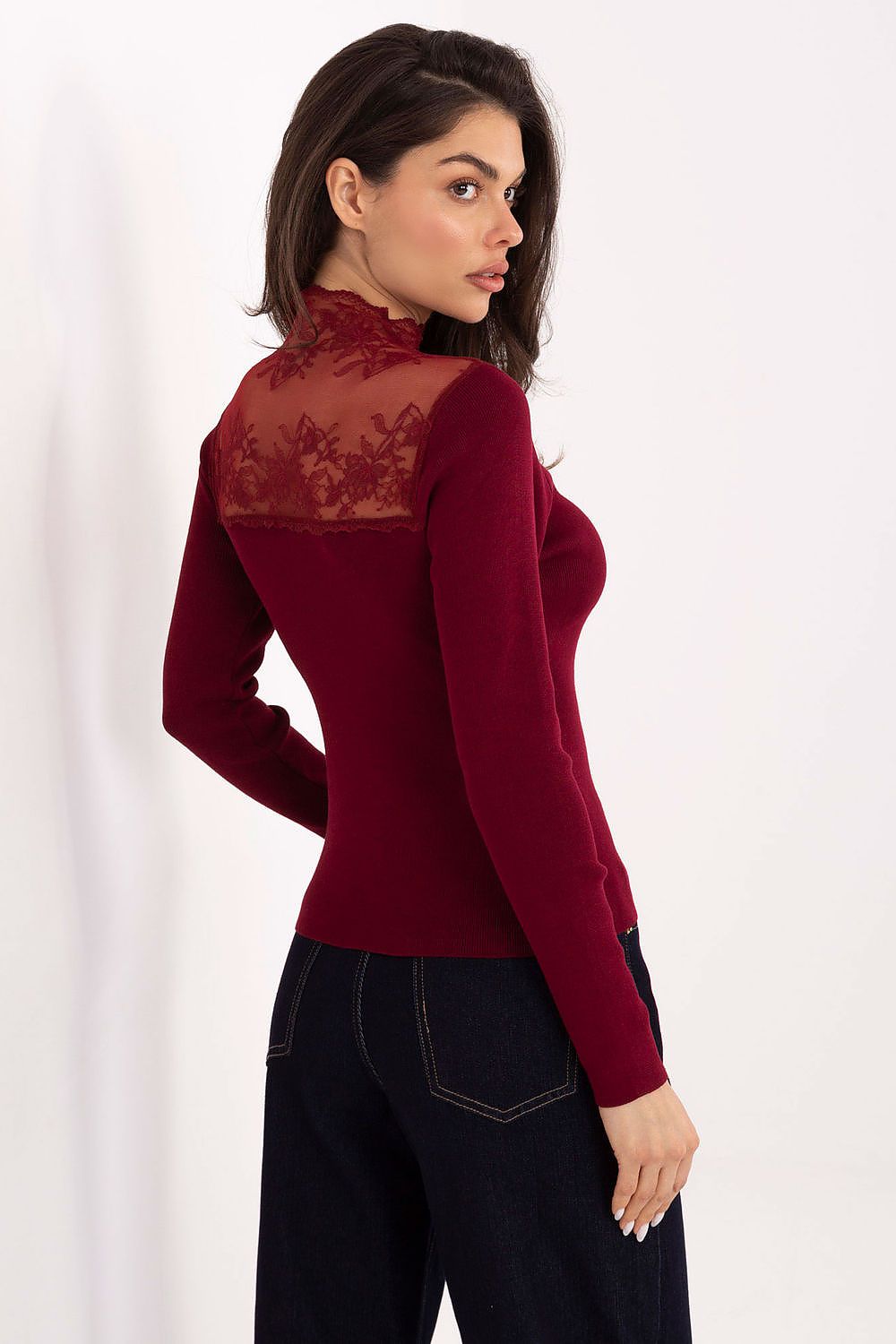 Model wearing an elegant women's blouse with a lace neckline and long sleeves, by Factory Price, exemplifying modern elegance for various occasions.