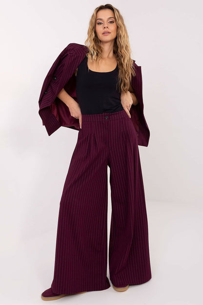 Chic pinstripe trousers by Rue Paris displayed on a mannequin, reflecting luxury fashion ideal for both office and evening wear.