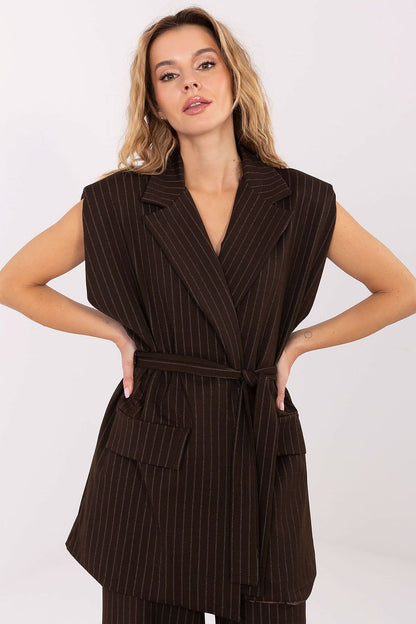 Model wearing the Elegant Striped Women's Gilet Vest with Tie Belt by Rue Paris in office setting, exemplifying modern workwear elegance.