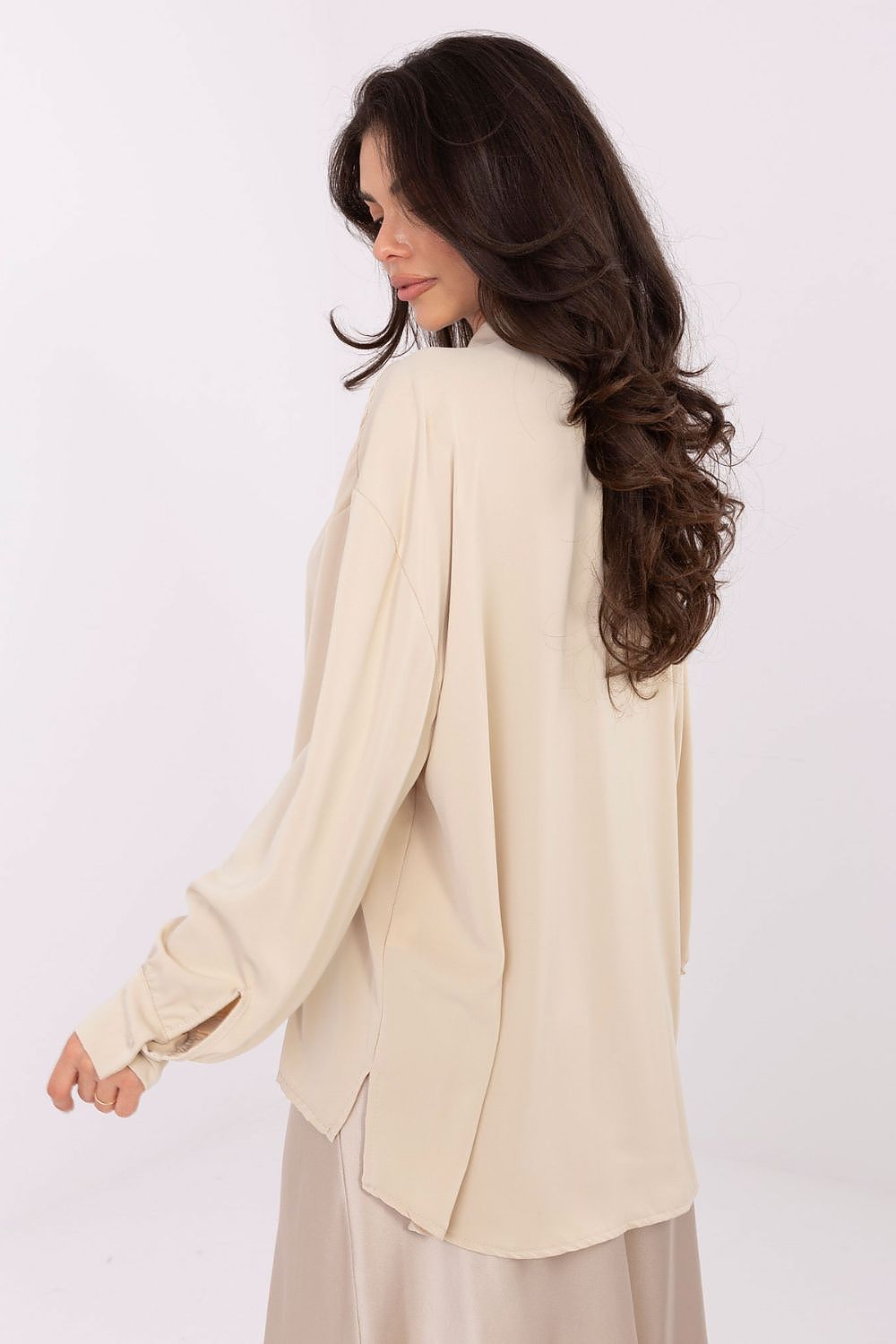 Detail view of the decorative jabot and puff sleeves on the elegant polyester blouse by Factory Price, representing modern sophistication.