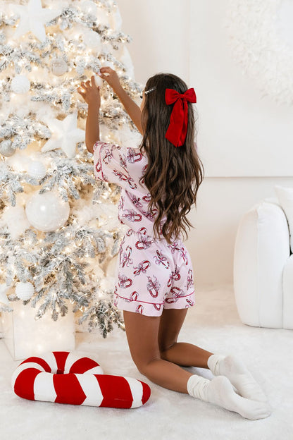 LaBalancia's Daisy Pink Candy Pajama Set displayed with a delicate floral design, epitomising sophisticated sleepwear.
